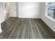 A bedroom with a large window and light-wood flooring at 1336 Weavers Trace Dr, Zebulon, NC 27597