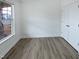 A simple bedroom with a large window and double closet at 1336 Weavers Trace Dr, Zebulon, NC 27597