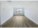 This bedroom features light-colored walls, a large window, and wood-look flooring, creating a bright and airy space at 1336 Weavers Trace Dr, Zebulon, NC 27597