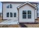The home has light siding and many large windows at 1336 Weavers Trace Dr, Zebulon, NC 27597