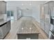 An open-concept kitchen overlooks a large living space at 1336 Weavers Trace Dr, Zebulon, NC 27597