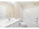 Well-lit bathroom featuring a shower-tub combo and vanity at 1420 Springshire Ct, Raleigh, NC 27610