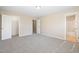 Bedroom with ensuite bathroom offers carpet flooring and closet space at 1420 Springshire Ct, Raleigh, NC 27610