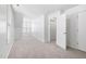 Bright bedroom with neutral carpet, white walls, and a window for natural light at 1420 Springshire Ct, Raleigh, NC 27610