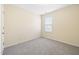 This bedroom is a cozy space with neutral carpet and a window for natural light at 1420 Springshire Ct, Raleigh, NC 27610
