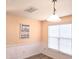 Bright dining room with a window and wainscoting, perfect for Gathering meals at 1420 Springshire Ct, Raleigh, NC 27610
