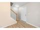 Bright foyer features wood-look flooring and a staircase leading to the upper level at 1420 Springshire Ct, Raleigh, NC 27610