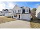 Charming two-story home with a covered front porch and attached garage at 1420 Springshire Ct, Raleigh, NC 27610