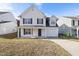 Charming two-story home with a covered front porch and attached garage at 1420 Springshire Ct, Raleigh, NC 27610