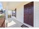 Inviting front entrance with a covered porch and stylish front door at 1420 Springshire Ct, Raleigh, NC 27610