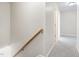 Upstairs hallway featuring neutral carpet, fresh paint, and access to various rooms at 1420 Springshire Ct, Raleigh, NC 27610