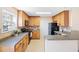 Traditional kitchen with wood cabinets and modern appliances at 1420 Springshire Ct, Raleigh, NC 27610
