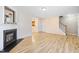 Open-concept living room with a fireplace and staircase at 1420 Springshire Ct, Raleigh, NC 27610