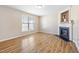 Cozy living room with a fireplace and large window at 1420 Springshire Ct, Raleigh, NC 27610
