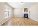 Bright living room with a fireplace and large window at 1420 Springshire Ct, Raleigh, NC 27610