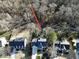 Aerial view of a residential property featuring the home's location with mature trees and proximity to the neighborhood at 1600 Patterson Grove Rd, Apex, NC 27502