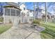 Backyard with screened-in porch, patio with fire pit, greenhouse, and grassy lawn at 1600 Patterson Grove Rd, Apex, NC 27502