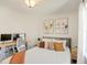 Cozy bedroom featuring a desk area and a queen-sized bed with modern art hanging on the wall at 1600 Patterson Grove Rd, Apex, NC 27502