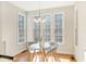 Cozy breakfast nook with a glass table and lots of natural light from large windows at 1600 Patterson Grove Rd, Apex, NC 27502