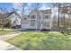 Beautiful two-story home with a well-manicured lawn, brick walkway, and an attached garage at 1600 Patterson Grove Rd, Apex, NC 27502