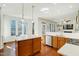 Spacious kitchen with white countertops and an island, seamlessly connected to the living area at 1600 Patterson Grove Rd, Apex, NC 27502