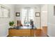 Bright home office with ample natural light, a large desk, and sophisticated decor at 1600 Patterson Grove Rd, Apex, NC 27502