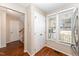 Pantry area with two bright windows and wood flooring at 1614 Oakland Hills Way, Raleigh, NC 27604