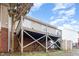 Elevated back deck supported by wooden beams and brick, with backyard access at 1614 W Cotton Gin Dr, Clayton, NC 27527