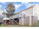 Enjoy this multi-tiered back deck with view of backyard and screened-in porch at 1614 W Cotton Gin Dr, Clayton, NC 27527