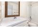 Bathroom features classic vanity and tub shower at 1614 W Cotton Gin Dr, Clayton, NC 27527