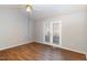 Large bedroom features a ceiling fan and exterior access via french doors at 1614 W Cotton Gin Dr, Clayton, NC 27527