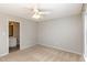 Bedroom has neutral carpet, ceiling fan, and en-suite bathroom access at 1614 W Cotton Gin Dr, Clayton, NC 27527