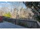 Enjoy the view from this home's private deck overlooking a serene wooded area at 1614 W Cotton Gin Dr, Clayton, NC 27527