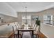 Bright dining room with hardwood floors, modern decor, and ample natural light at 1614 W Cotton Gin Dr, Clayton, NC 27527