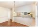 Open dining space with a view of the kitchen, featuring granite countertops at 1614 W Cotton Gin Dr, Clayton, NC 27527