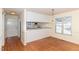 Inviting dining area features hardwood floors and natural light from the nearby window at 1614 W Cotton Gin Dr, Clayton, NC 27527
