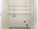 Laundry room ready for washer and dryer install features practical shelving at 1614 W Cotton Gin Dr, Clayton, NC 27527