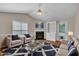Inviting living room with fireplace, plush seating, and bright natural light at 1614 W Cotton Gin Dr, Clayton, NC 27527