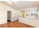 Bright living room features hardwood floors, neutral walls, and access to the kitchen and other rooms at 1614 W Cotton Gin Dr, Clayton, NC 27527