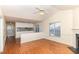 Open living room featuring hardwood floors, neutral walls, and direct access to the kitchen at 1614 W Cotton Gin Dr, Clayton, NC 27527