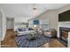 Cozy living room with comfortable seating, fireplace, and open floor plan at 1614 W Cotton Gin Dr, Clayton, NC 27527