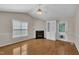 Living room with fireplace, built-in bookcase and hardwood floors at 1614 W Cotton Gin Dr, Clayton, NC 27527