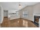Spacious living room features hardwood floors, fireplace and opens to kitchen at 1614 W Cotton Gin Dr, Clayton, NC 27527