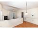 Bright living room features hardwood floors, a fireplace, and built-in shelving with easy access to the back patio at 1614 W Cotton Gin Dr, Clayton, NC 27527