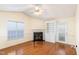 Bright living room with a fireplace and a built-in bookshelf at 1614 W Cotton Gin Dr, Clayton, NC 27527