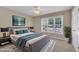 Staged bedroom with a ceiling fan, large window, stylish furniture, and coordinated décor at 1614 W Cotton Gin Dr, Clayton, NC 27527