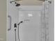Modern shower featuring a rainfall shower head, handheld sprayer, and a convenient built-in niche at 1614 W Cotton Gin Dr, Clayton, NC 27527