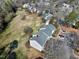 Townhouse complex aerial view highlighting its location near grassy fields and parking at 174 St. Andrews Ln, Chapel Hill, NC 27517