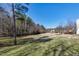 A spacious backyard with a view of the wooded area, perfect for recreation at 174 St. Andrews Ln, Chapel Hill, NC 27517