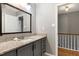 Bathroom with granite countertops, updated fixtures and large mirror at 174 St. Andrews Ln, Chapel Hill, NC 27517